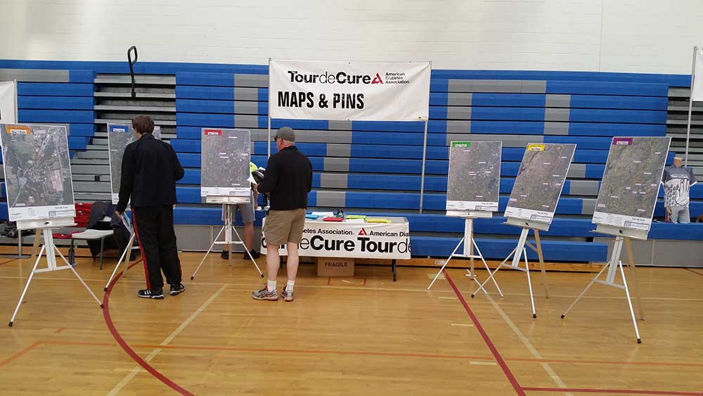 C.T. Male Associates studying the Tour de Cure Maps