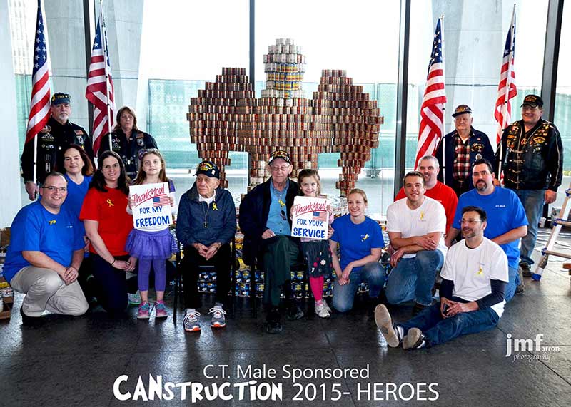 CT Male Associates and Veterans posing in front of 2015 Canstruction entry